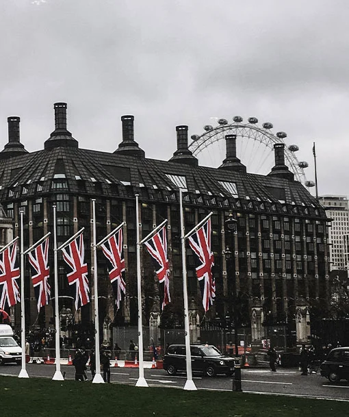 UK Flags flying before a building