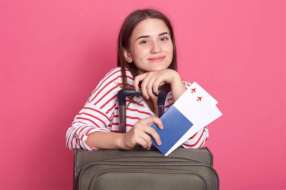 A girl student holding VISA in her hands which she got through Edulife Abroad Consultancy